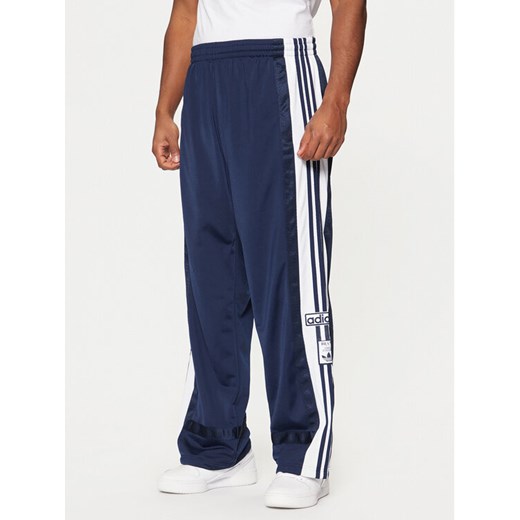adidas Spodnie dresowe Adibreak JD4268 Granatowy Loose Fit ze sklepu MODIVO w kategorii Spodnie męskie - zdjęcie 182660776