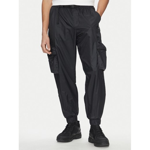 Nike Spodnie dresowe FB7911 010 Czarny Regular Fit ze sklepu MODIVO w kategorii Spodnie męskie - zdjęcie 182664179