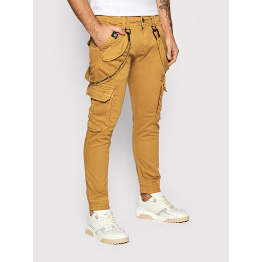 Alpha Industries Spodnie materiałowe Utility 128202 Brązowy Slim Fit ze sklepu MODIVO w kategorii Spodnie męskie - zdjęcie 182665318