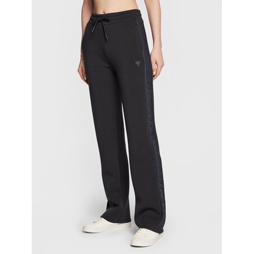 Guess Spodnie dresowe V3RB21 K7UW2 Granatowy Regular Fit ze sklepu MODIVO w kategorii Spodnie damskie - zdjęcie 182666495