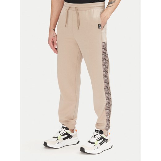 EA7 Emporio Armani Spodnie dresowe 7M000216 AF12660 U6155 Beżowy Regular Fit ze sklepu MODIVO w kategorii Spodnie męskie - zdjęcie 182668375