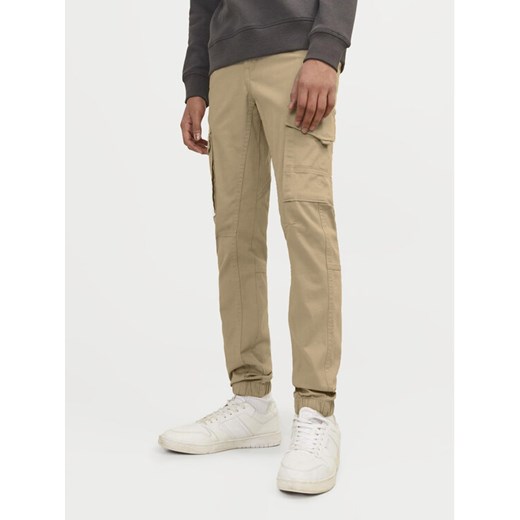 Jack&Jones Junior Spodnie materiałowe Paul 12193900 Beżowy Slim Fit ze sklepu MODIVO w kategorii Spodnie chłopięce - zdjęcie 182669347