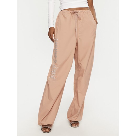 Juicy Couture Spodnie dresowe Ayla JCWBJ24306 Beżowy Loose Fit ze sklepu MODIVO w kategorii Spodnie damskie - zdjęcie 182669546