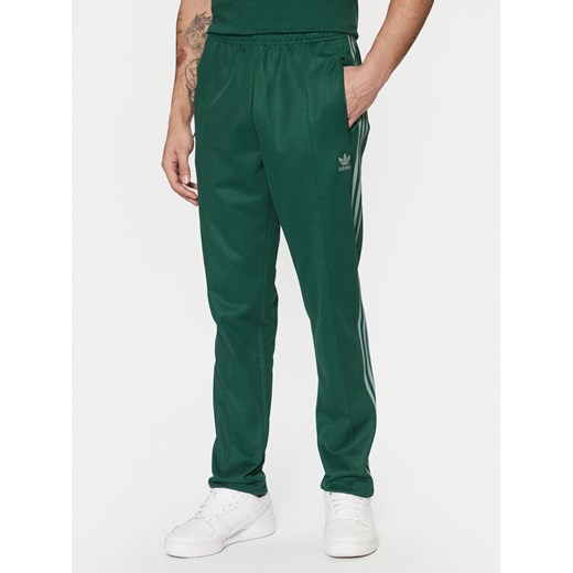 adidas Spodnie dresowe adicolor Classics Beckenbauer JP2523 Zielony Slim Fit ze sklepu MODIVO w kategorii Spodnie męskie - zdjęcie 182670716