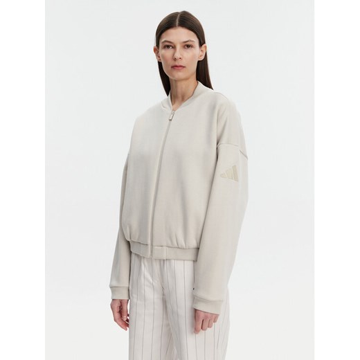 adidas Bluza Essentials Contemporary Logo JD9972 Beżowy Loose Fit ze sklepu MODIVO w kategorii Bluzy damskie - zdjęcie 182671839