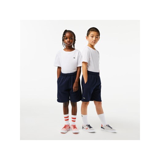 Lacoste Szorty sportowe GJ9733 Granatowy Regular Fit ze sklepu MODIVO w kategorii Spodenki chłopięce - zdjęcie 182671846