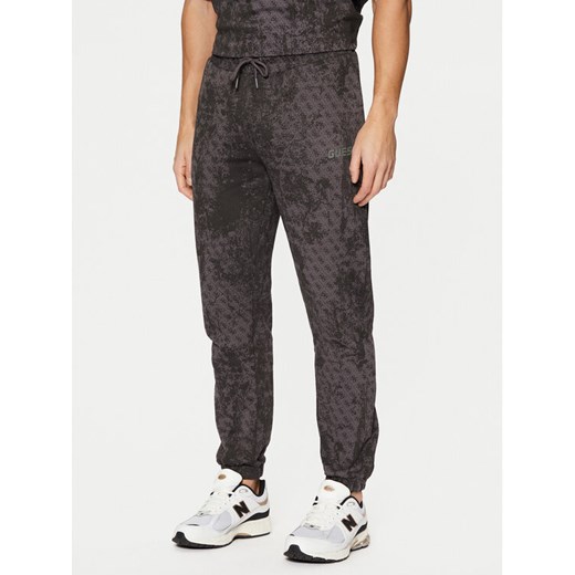 Guess Spodnie dresowe Z5RB14 K9YI1 Szary Regular Fit ze sklepu MODIVO w kategorii Spodnie męskie - zdjęcie 182672805