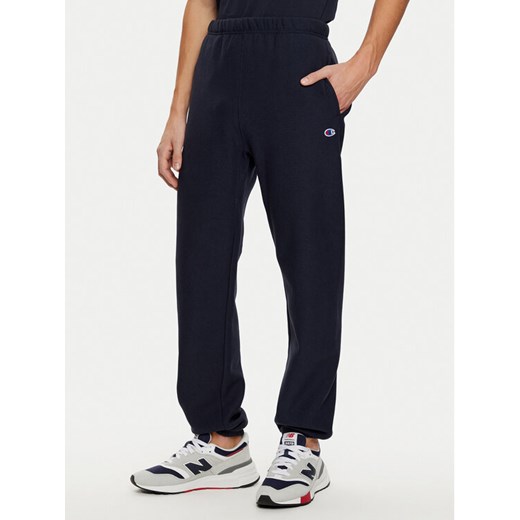 Champion Spodnie dresowe 220709 Granatowy Relaxed Fit ze sklepu MODIVO w kategorii Spodnie męskie - zdjęcie 182673727