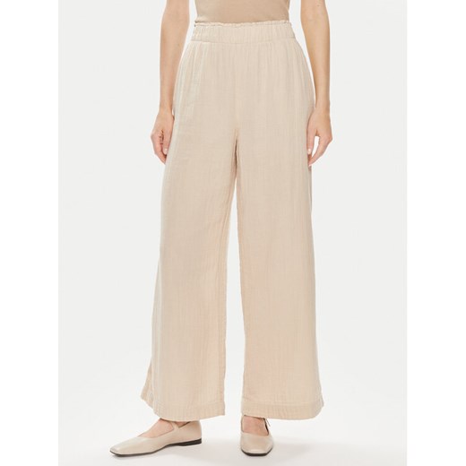 Gap Spodnie materiałowe 855967-01 Beżowy Relaxed Fit ze sklepu MODIVO w kategorii Spodnie damskie - zdjęcie 182674296