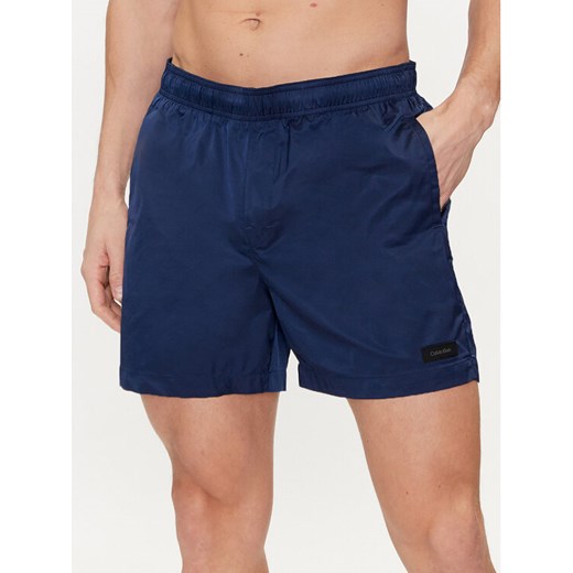 Calvin Klein Swimwear Szorty kąpielowe KM0KM00939 Granatowy Regular Fit ze sklepu MODIVO w kategorii Kąpielówki - zdjęcie 182675046