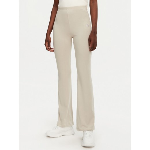 adidas Legginsy Essentials Small Logo JD3072 Beżowy Flare Fit ze sklepu MODIVO w kategorii Spodnie damskie - zdjęcie 182678065