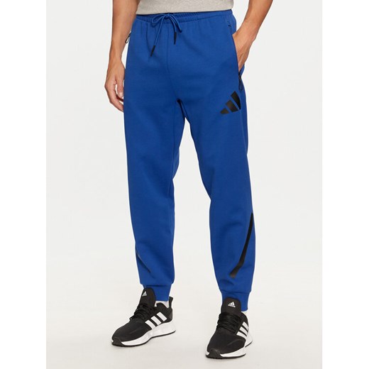 adidas Spodnie dresowe Z.N.E. JF6541 Niebieski Regular Fit ze sklepu MODIVO w kategorii Spodnie męskie - zdjęcie 182678149