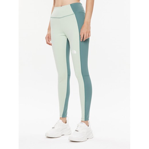 The North Face Legginsy Ma NF0A856I Zielony Regular Fit ze sklepu MODIVO w kategorii Spodnie damskie - zdjęcie 182679358