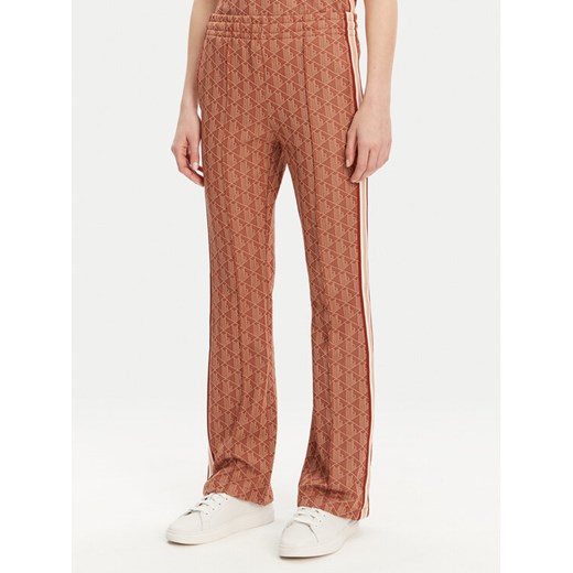 Lacoste Spodnie dresowe XF9313 Pomarańczowy Regular Fit ze sklepu MODIVO w kategorii Spodnie damskie - zdjęcie 182679398