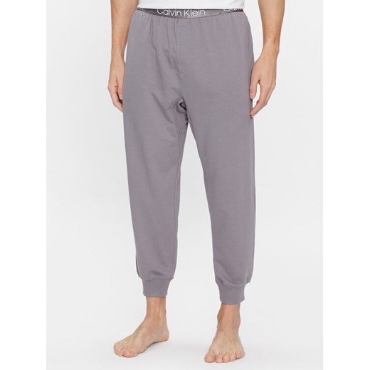 Calvin Klein Underwear Spodnie piżamowe 000NM2175E Szary Regular Fit ze sklepu MODIVO w kategorii Piżamy męskie - zdjęcie 182680028