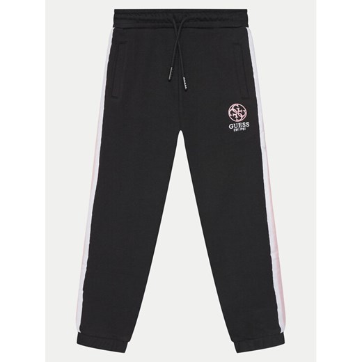 Guess Spodnie dresowe J5RQ11 KAD74 Czarny Regular Fit ze sklepu MODIVO w kategorii Spodnie chłopięce - zdjęcie 182681119