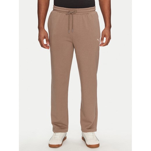 Puma Spodnie dresowe Ess 629651 Brązowy Relaxed Fit ze sklepu MODIVO w kategorii Spodnie męskie - zdjęcie 182681297