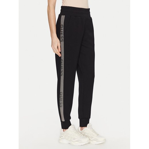 Guess Spodnie dresowe W5RB00 KBYE2 Czarny Regular Fit ze sklepu MODIVO w kategorii Spodnie damskie - zdjęcie 182681515