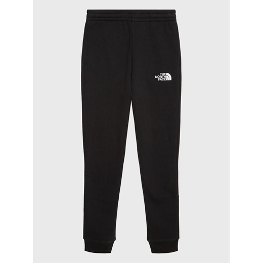 The North Face Spodnie dresowe Teen NF0A82EO Czarny Regular Fit ze sklepu MODIVO w kategorii Spodnie chłopięce - zdjęcie 182683439