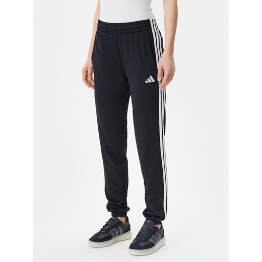 adidas Spodnie dresowe Tricot 3-Stripes JF3383 Czarny Regular Fit ze sklepu MODIVO w kategorii Spodnie damskie - zdjęcie 182684309