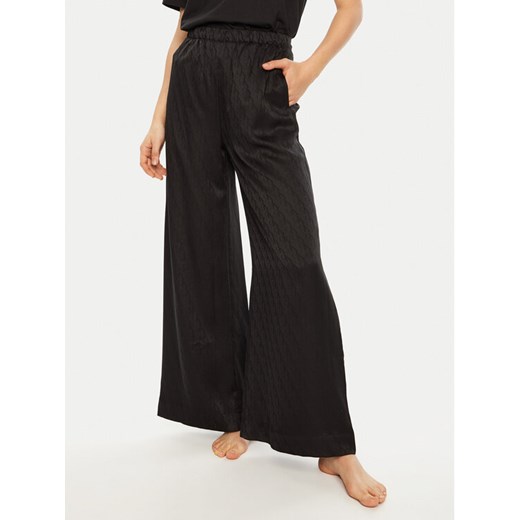Calvin Klein Spodnie piżamowe 000QS7304E Czarny Relaxed Fit ze sklepu MODIVO w kategorii Piżamy damskie - zdjęcie 182686335