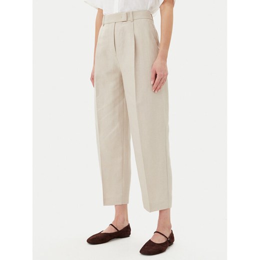 Tommy Hilfiger Spodnie materiałowe WW0WW45461 Beżowy Tapered Fit ze sklepu MODIVO w kategorii Spodnie damskie - zdjęcie 182687499
