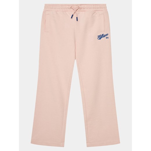 Tommy Hilfiger Spodnie dresowe Hilfiger Script Wide Sweatpant KG0KG07751 Różowy Regular Fit ze sklepu MODIVO w kategorii Spodnie dziewczęce - zdjęcie 182689228