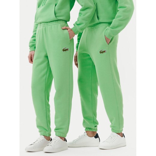 Lacoste Spodnie dresowe XH2750 Zielony Relaxed Fit ze sklepu MODIVO w kategorii Spodnie męskie - zdjęcie 182689697