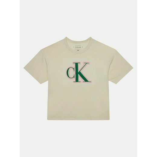 Calvin Klein Jeans T-Shirt IG0IG02806 Écru Boxy Fit ze sklepu MODIVO w kategorii Bluzki dziewczęce - zdjęcie 182691666