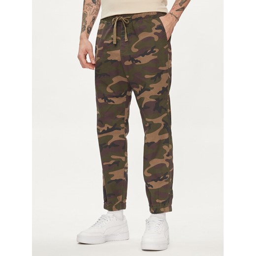 Gap Joggery 496157-00 Zielony Slim Fit ze sklepu MODIVO w kategorii Spodnie męskie - zdjęcie 182693195
