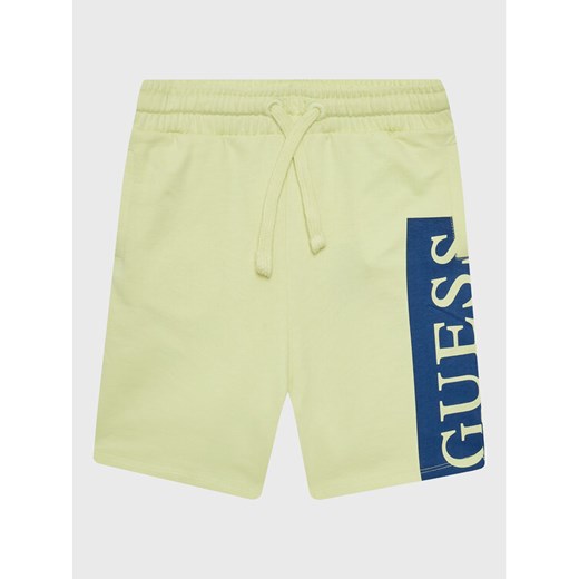 Guess Szorty sportowe L3GD03 KA6R0 Żółty Relaxed Fit ze sklepu MODIVO w kategorii Spodenki chłopięce - zdjęcie 182693466