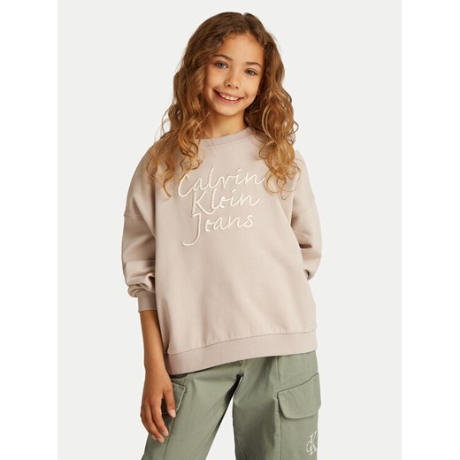 Calvin Klein Jeans Bluza IG0IG02760 Beżowy Regular Fit ze sklepu MODIVO w kategorii Bluzy dziewczęce - zdjęcie 182698756