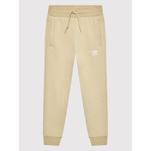 adidas Spodnie dresowe adicolor HK2860 Beżowy Regular Fit 7_8Y MODIVO