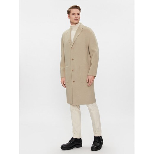 Calvin Klein Płaszcz wełniany K10K111601 Beżowy Regular Fit ze sklepu MODIVO w kategorii Płaszcze męskie - zdjęcie 182700228