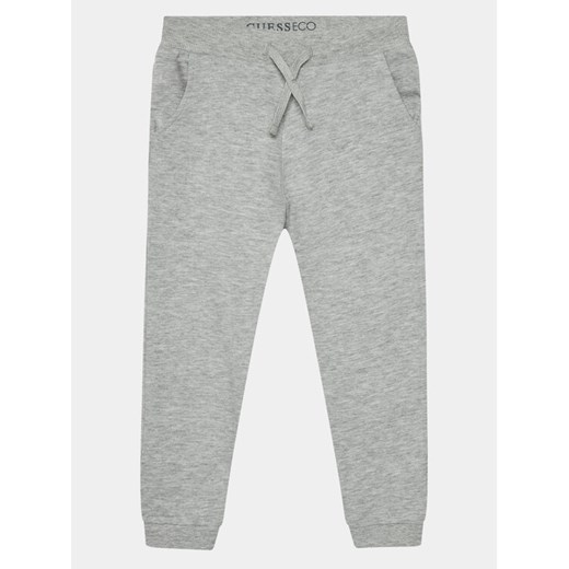 Guess Spodnie dresowe N93Q17 KAUG0 Szary Regular Fit ze sklepu MODIVO w kategorii Spodnie i półśpiochy - zdjęcie 182700449