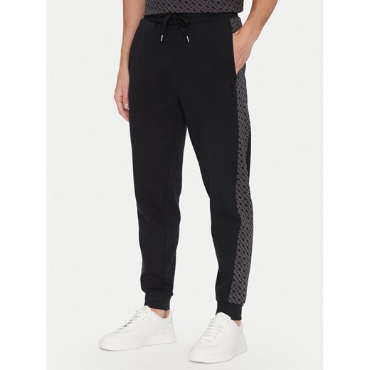 BOSS Spodnie dresowe Luke 50546839 Czarny Regular Fit ze sklepu MODIVO w kategorii Spodnie męskie - zdjęcie 182700749