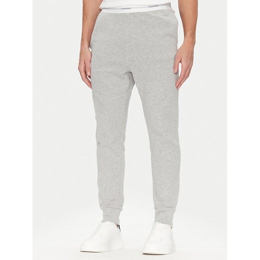 Calvin Klein Underwear Spodnie piżamowe 000NM2706E Szary Regular Fit ze sklepu MODIVO w kategorii Piżamy męskie - zdjęcie 182702436