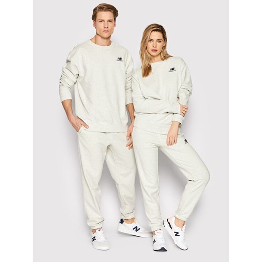 New Balance Spodnie dresowe Unisex UP21500 Szary Ahletic Fit ze sklepu MODIVO w kategorii Spodnie damskie - zdjęcie 182702729