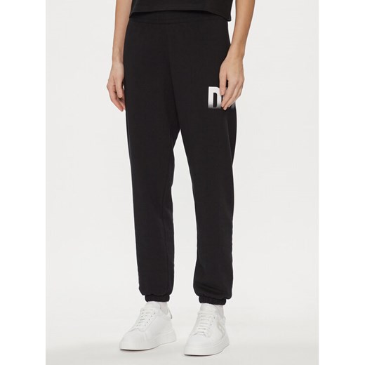 DKNY Sport Spodnie dresowe DP3P3379 Czarny Relaxed Fit ze sklepu MODIVO w kategorii Spodnie damskie - zdjęcie 182704035