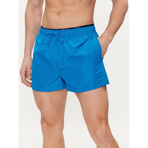 Calvin Klein Swimwear Szorty kąpielowe KM0KM00947 Niebieski Regular Fit ze sklepu MODIVO w kategorii Kąpielówki - zdjęcie 182706475