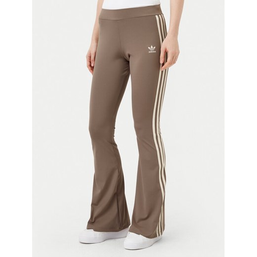 adidas Legginsy JD4601 Beżowy Flare Fit ze sklepu MODIVO w kategorii Spodnie damskie - zdjęcie 182707575