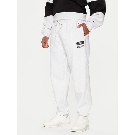 Champion Spodnie dresowe 220434 Szary Loose Fit ze sklepu MODIVO w kategorii Spodnie męskie - zdjęcie 182708339