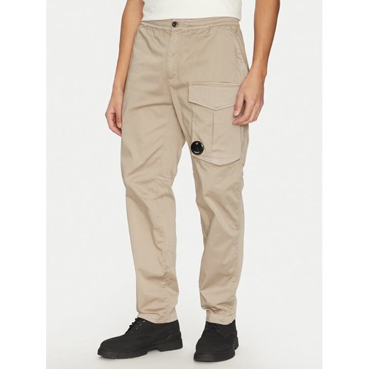 C.P. Company Spodnie materiałowe 18CMPA169A005694G Beżowy Relaxed Fit ze sklepu MODIVO w kategorii Spodnie męskie - zdjęcie 182708729
