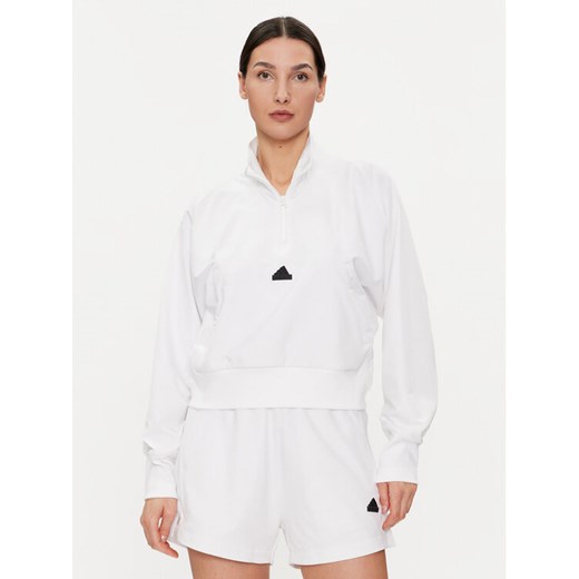 adidas Bluza Z.N.E. IN9478 Biały Relaxed Fit ze sklepu MODIVO w kategorii Bluzy damskie - zdjęcie 182709746