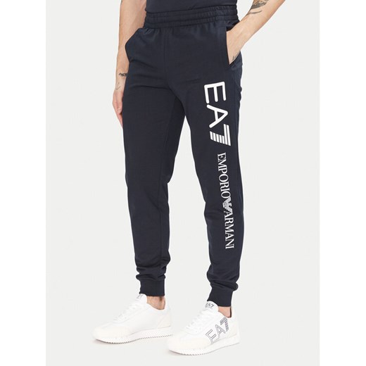 EA7 Emporio Armani Spodnie dresowe 7M000571 AF13512 MB149 Granatowy Regular Fit ze sklepu MODIVO w kategorii Spodnie męskie - zdjęcie 182711308