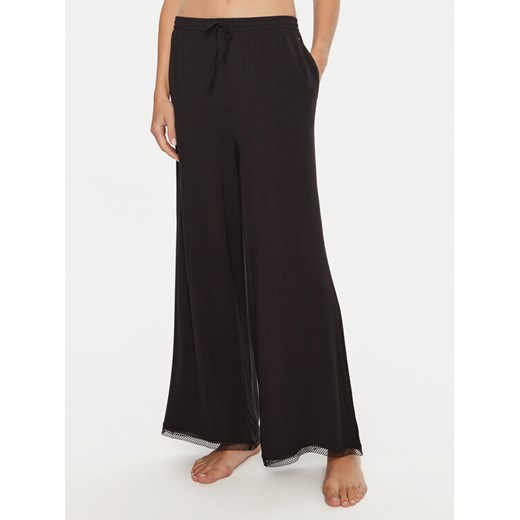 Tommy Hilfiger Spodnie piżamowe UW0UW05575 Czarny Relaxed Fit ze sklepu MODIVO w kategorii Piżamy damskie - zdjęcie 182714018