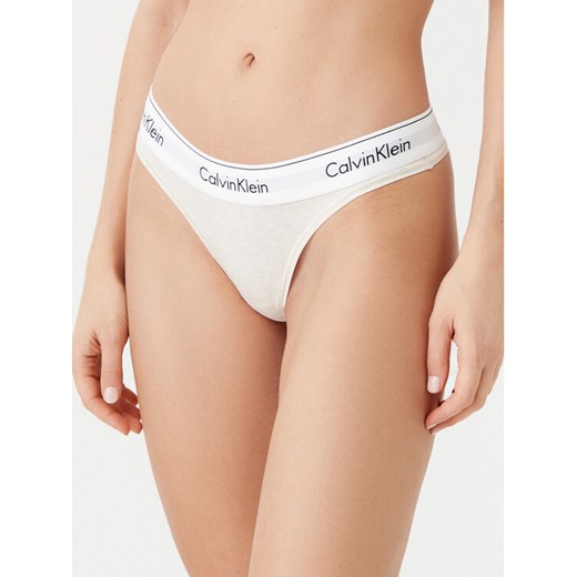 Calvin Klein Underwear Stringi 0000F3786E Beżowy ze sklepu MODIVO w kategorii Majtki damskie - zdjęcie 182714668