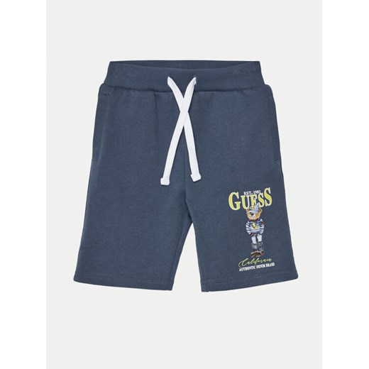 Guess Szorty materiałowe N5RD03 KAD74 Granatowy Relaxed Fit ze sklepu MODIVO w kategorii Spodenki chłopięce - zdjęcie 182715285