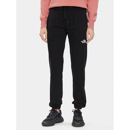 The North Face Spodnie dresowe Standard NF0A5ID4 Czarny Regular Fit ze sklepu MODIVO w kategorii Spodnie damskie - zdjęcie 182715789