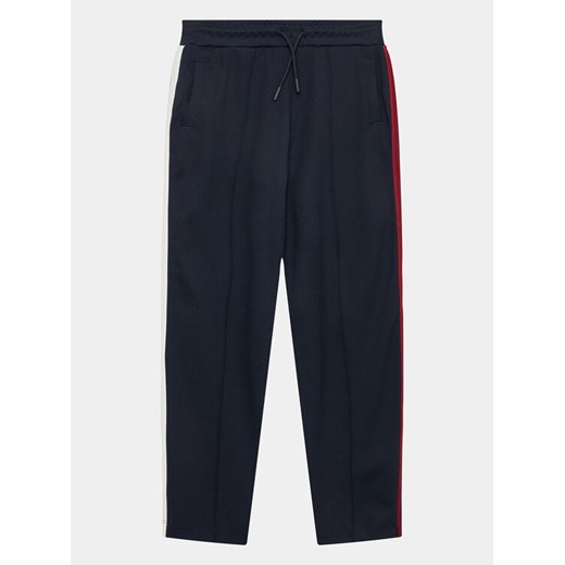 Tommy Hilfiger Spodnie dresowe KG0KG07407 Granatowy Regular Fit ze sklepu MODIVO w kategorii Spodnie chłopięce - zdjęcie 182716786